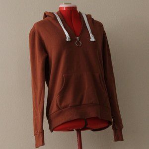 Reflex sweater. Worn but still good quality. warm orange and size medium.